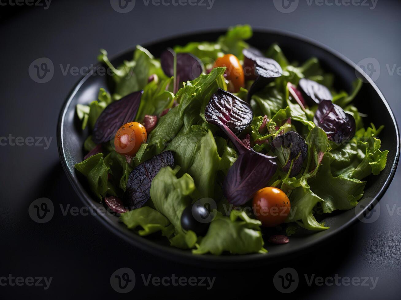 A black bowl filled with a salad with tomatoes and beets photo