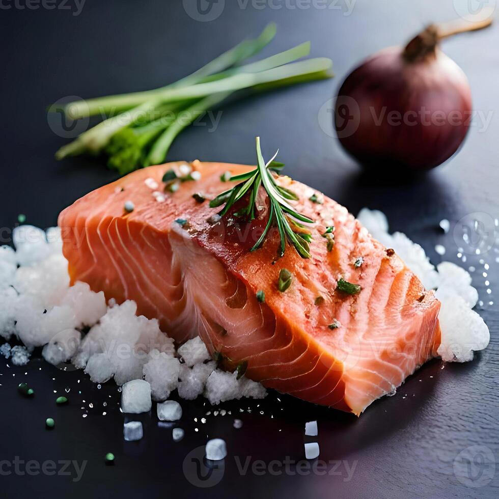 Salmon with rosemary and salt on a black background photo