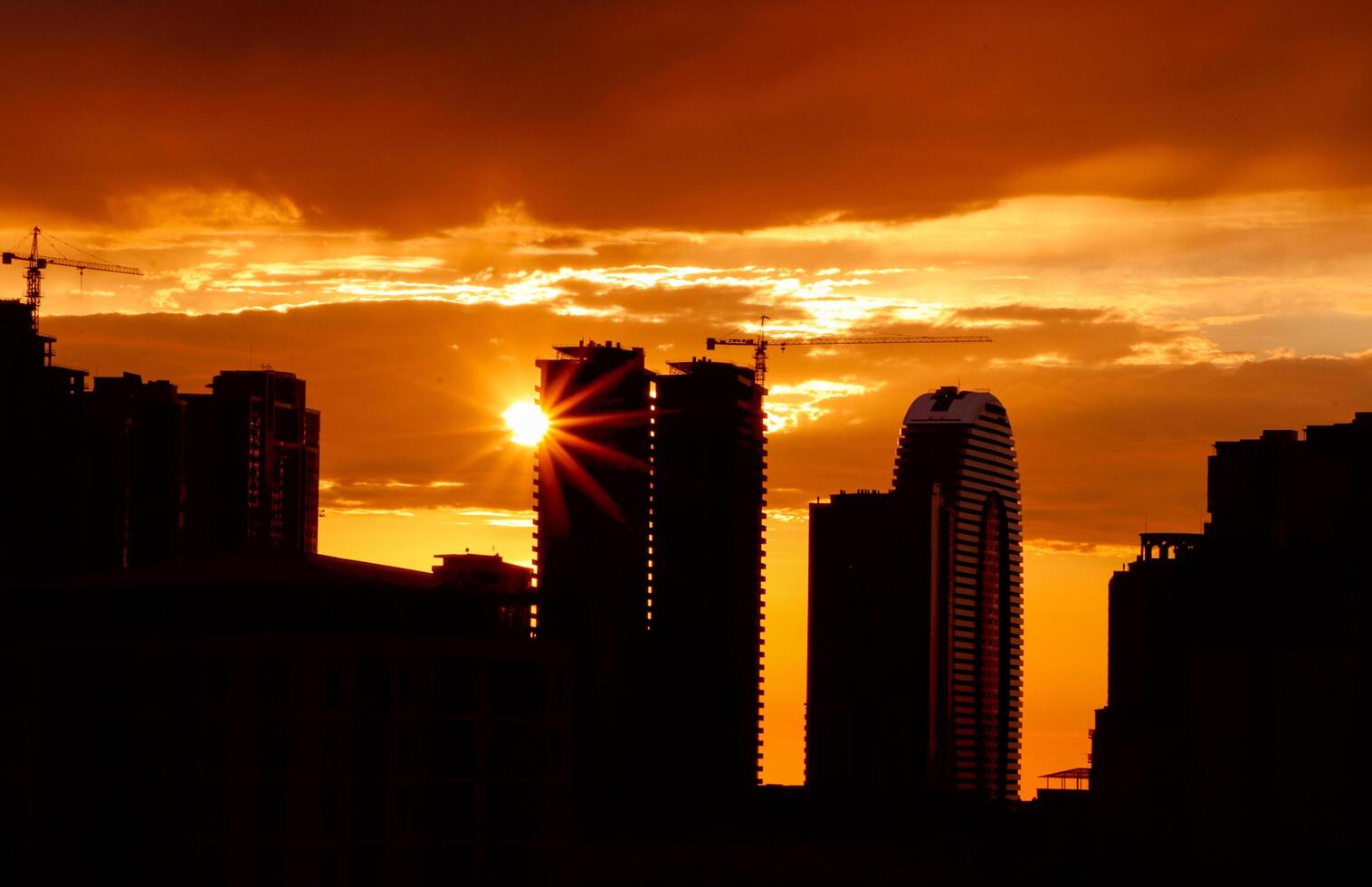 City evening landscape with sunset. Sunset is in the town. photo