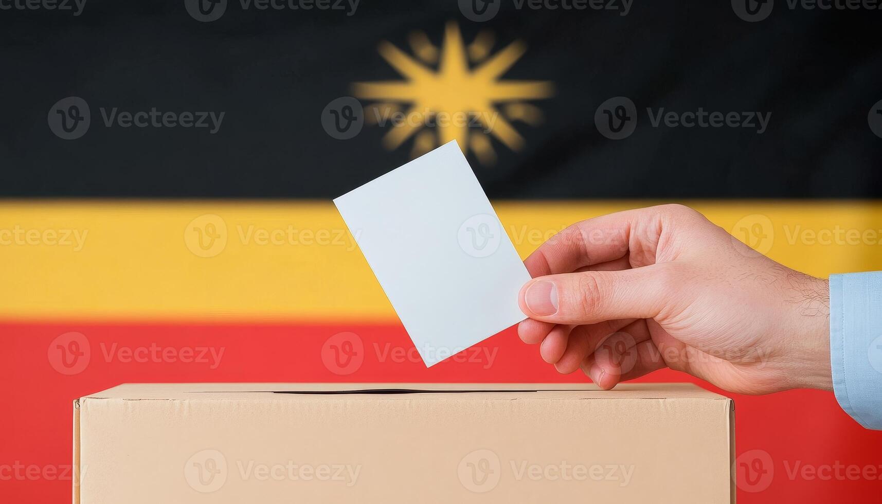 Hand Voting in Ballot Box with Aboriginal Flag Background, Election and Democracy Concept photo
