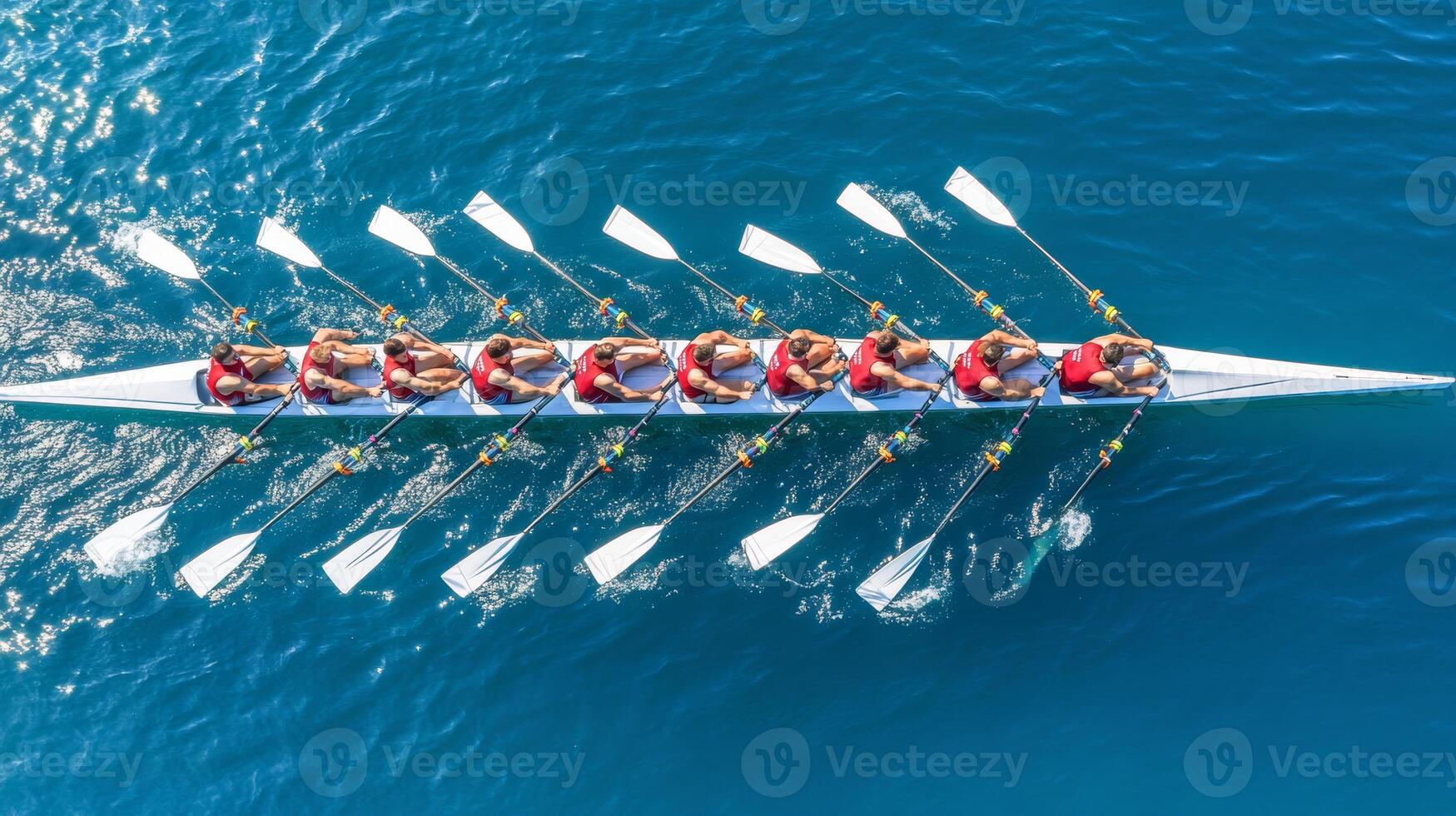 Synchronized Rowing Team in Red, Eight Rowers Powering Through Blue Water, Cooperation Concept photo