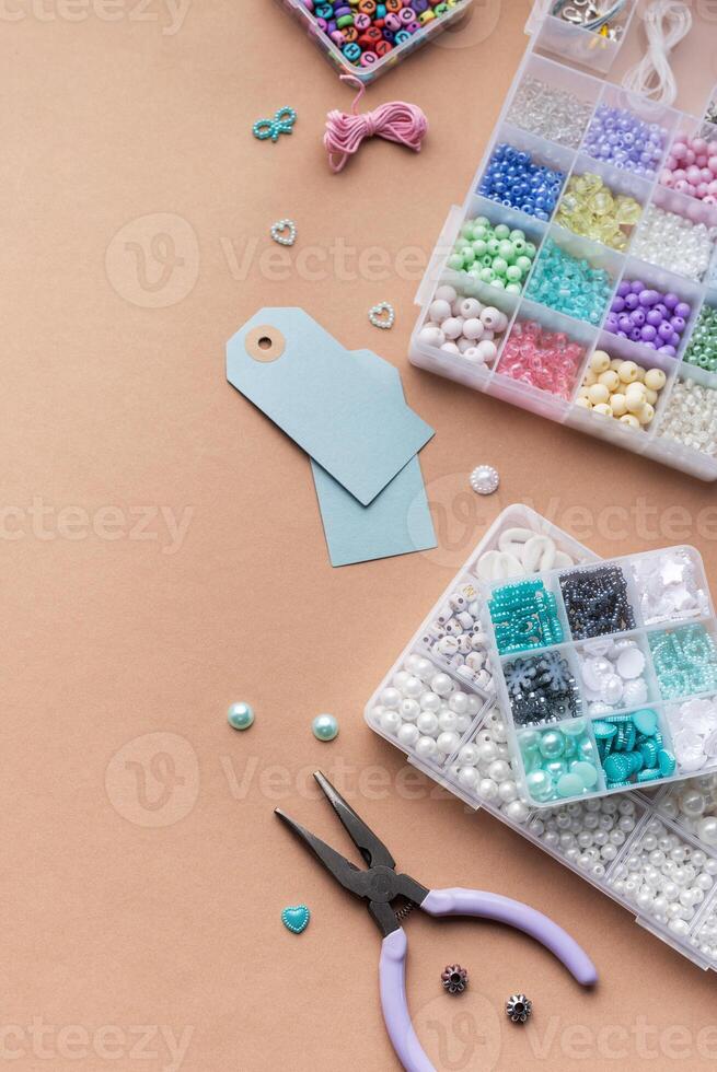 Creating personalized crafts with beads and tags on a light background for various DIY projects photo