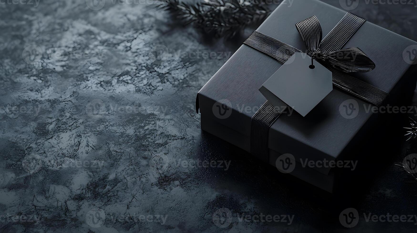 Black stylish gif box alone on black surface with text space. Holiday marketing Black Friday sales photo