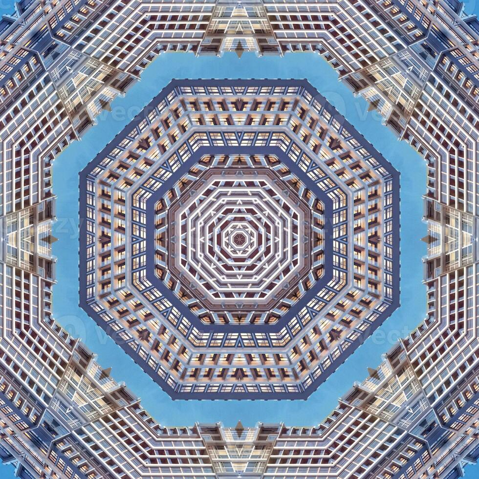 Symmetrical Architectural Kaleidoscope with Geometric Patterns and Urban Reflections Against Blue Sky photo