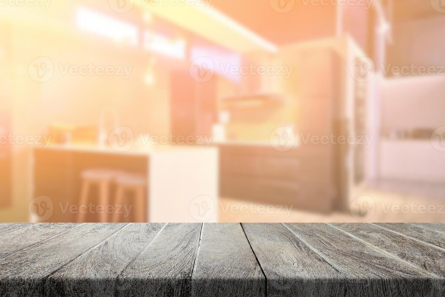 Wooden Table with Blurred Kitchen Interior Background with Light Leak. photo