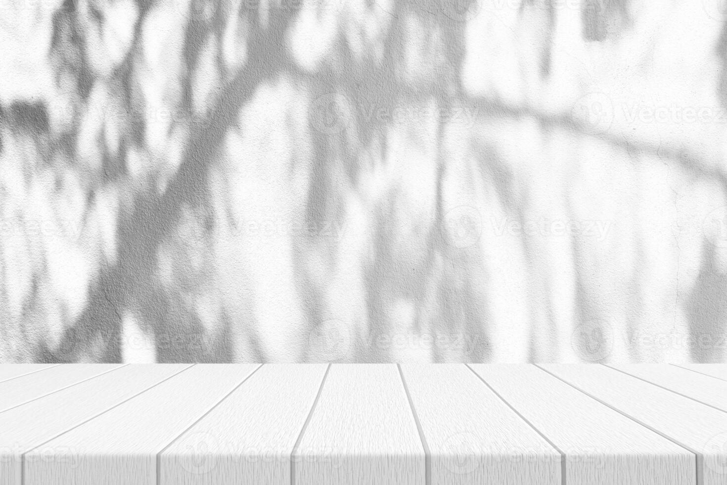White Wood Table with Pine Tree Shadow on Concrete Wall Texture Background photo