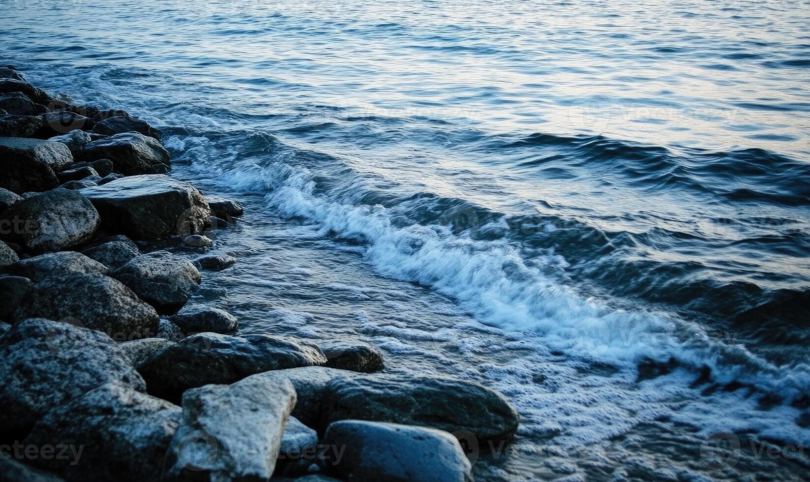 The ocean is calm and the waves are small photo