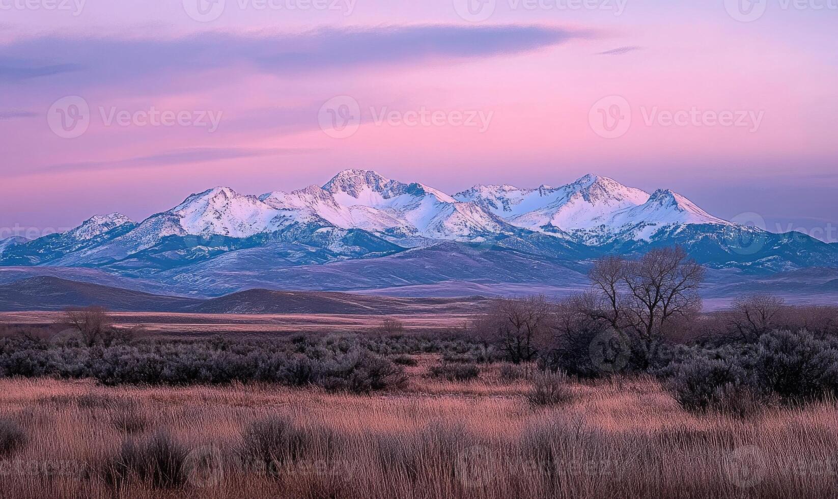 A mountain range is visible in the distance with a beautiful pink and purple sky photo