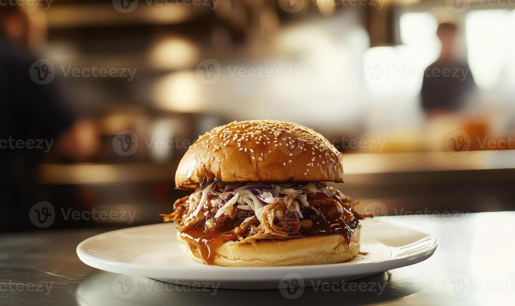 A plate with a pulled pork sandwich on it photo