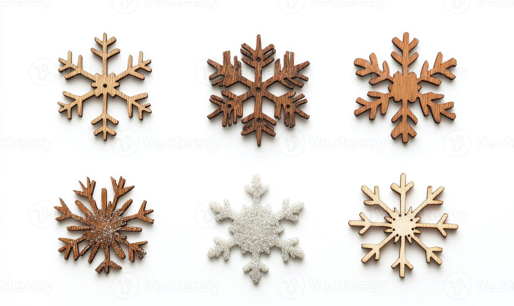 A set of wooden snowflakes with different sizes and designs photo