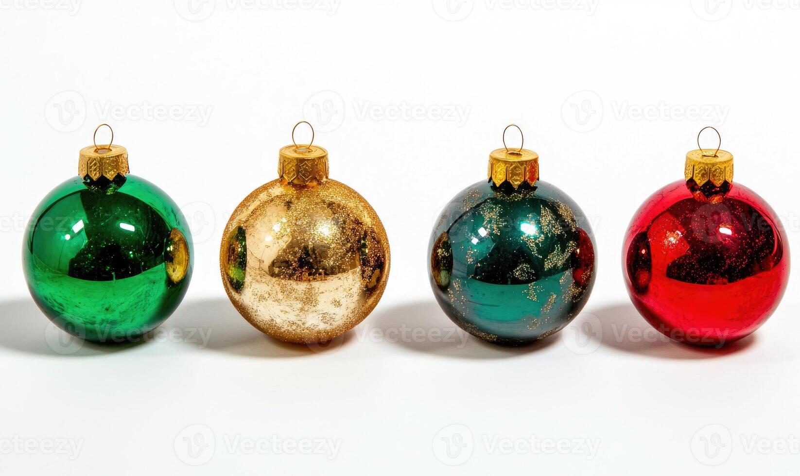 Four Christmas ornaments with gold and green and red and gold colors photo