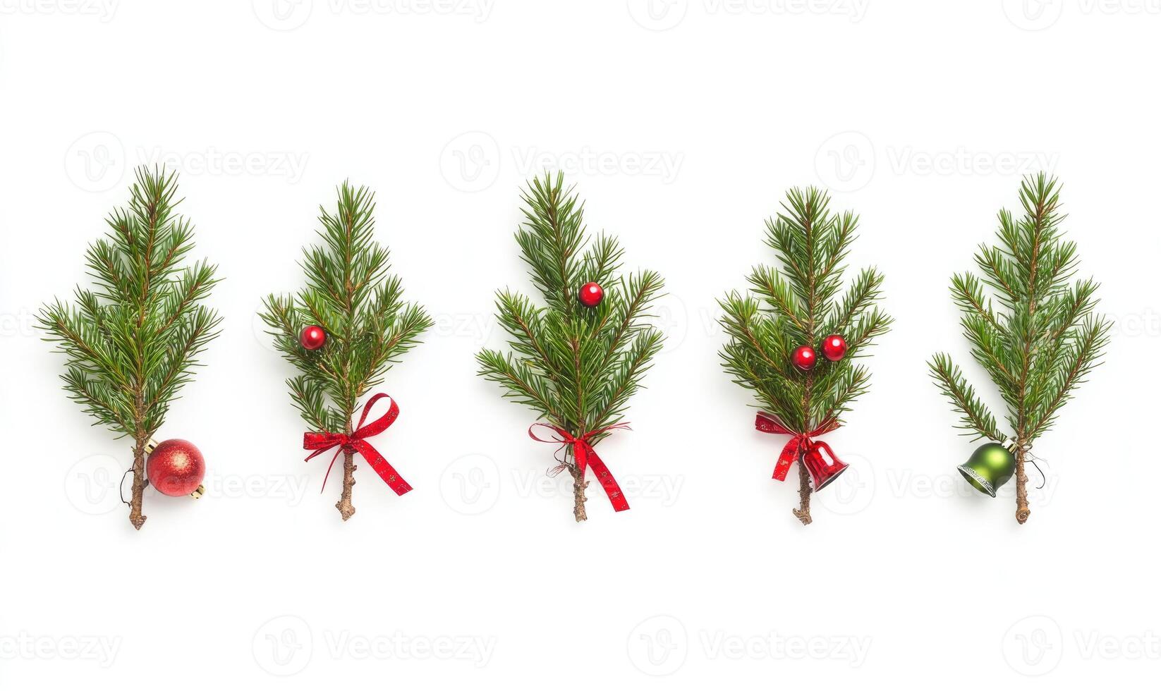 A row of Christmas trees with red ribbons and green bells hanging from them photo