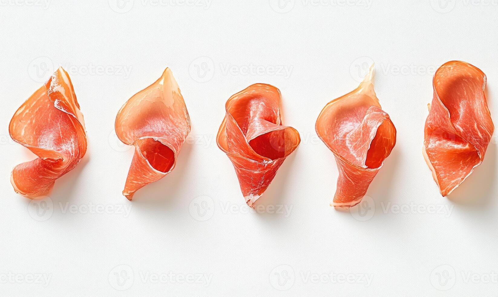A row of meat slices are arranged on a white background photo
