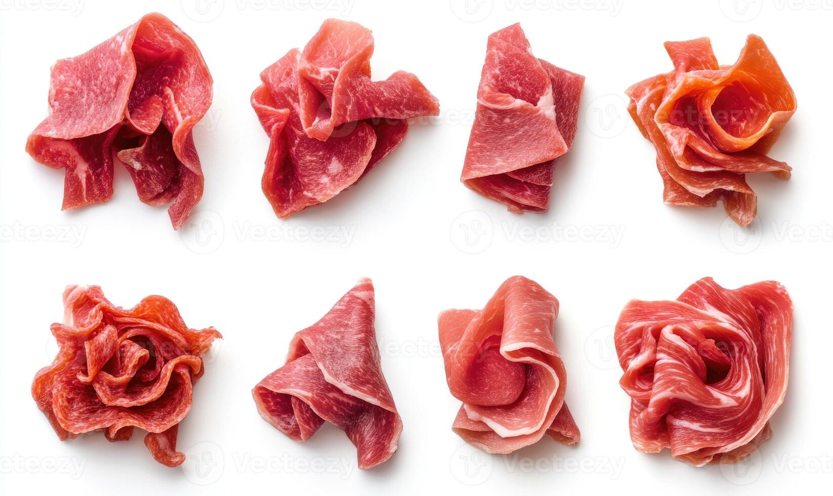 A close up of various pieces of meat, including a slice of pepperoni photo