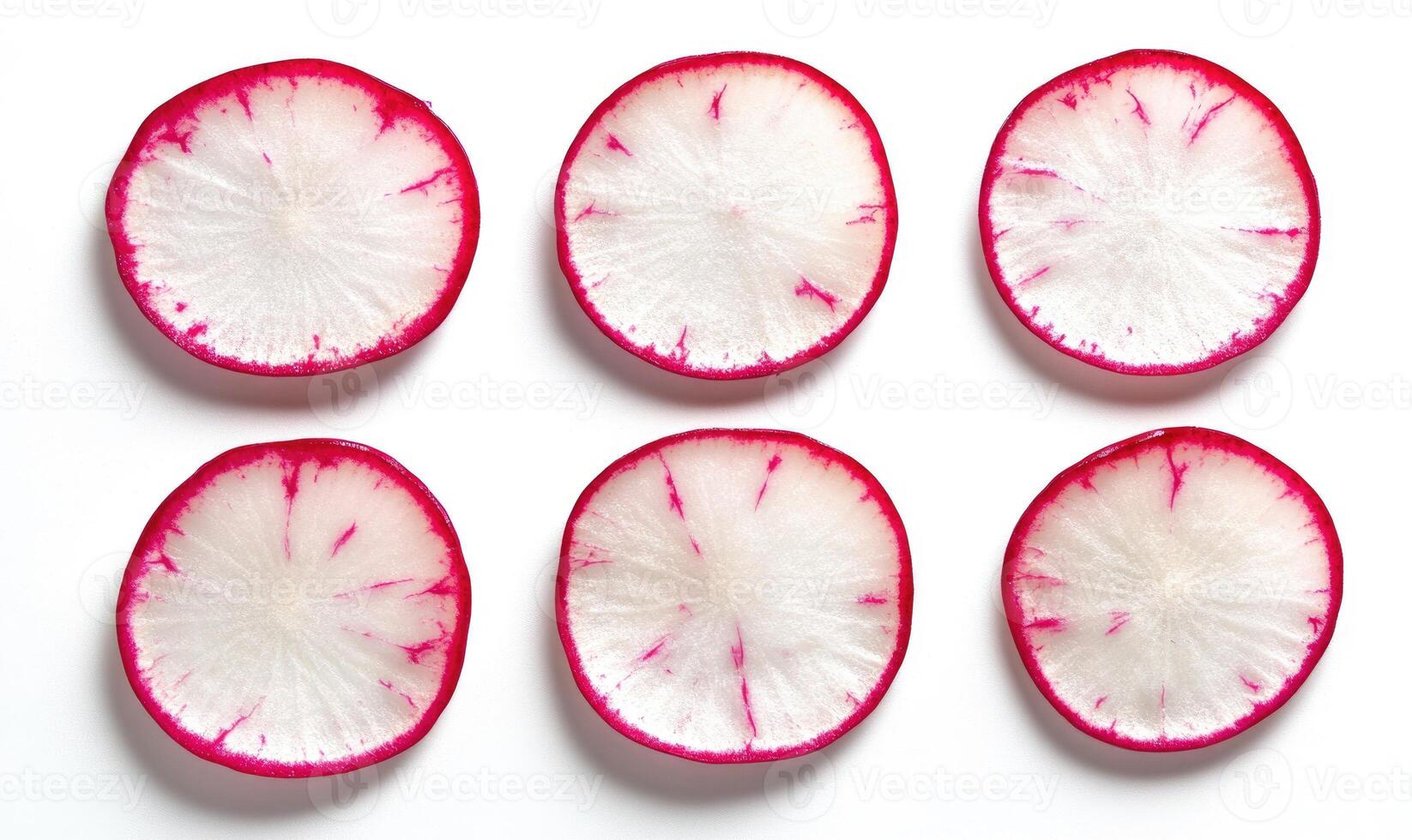 A close up of six radishes, each with a white and pink center photo