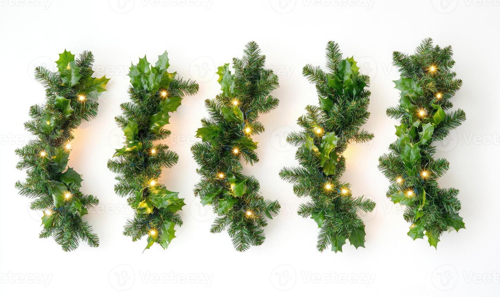 A row of green Christmas tree branches with lights on them photo