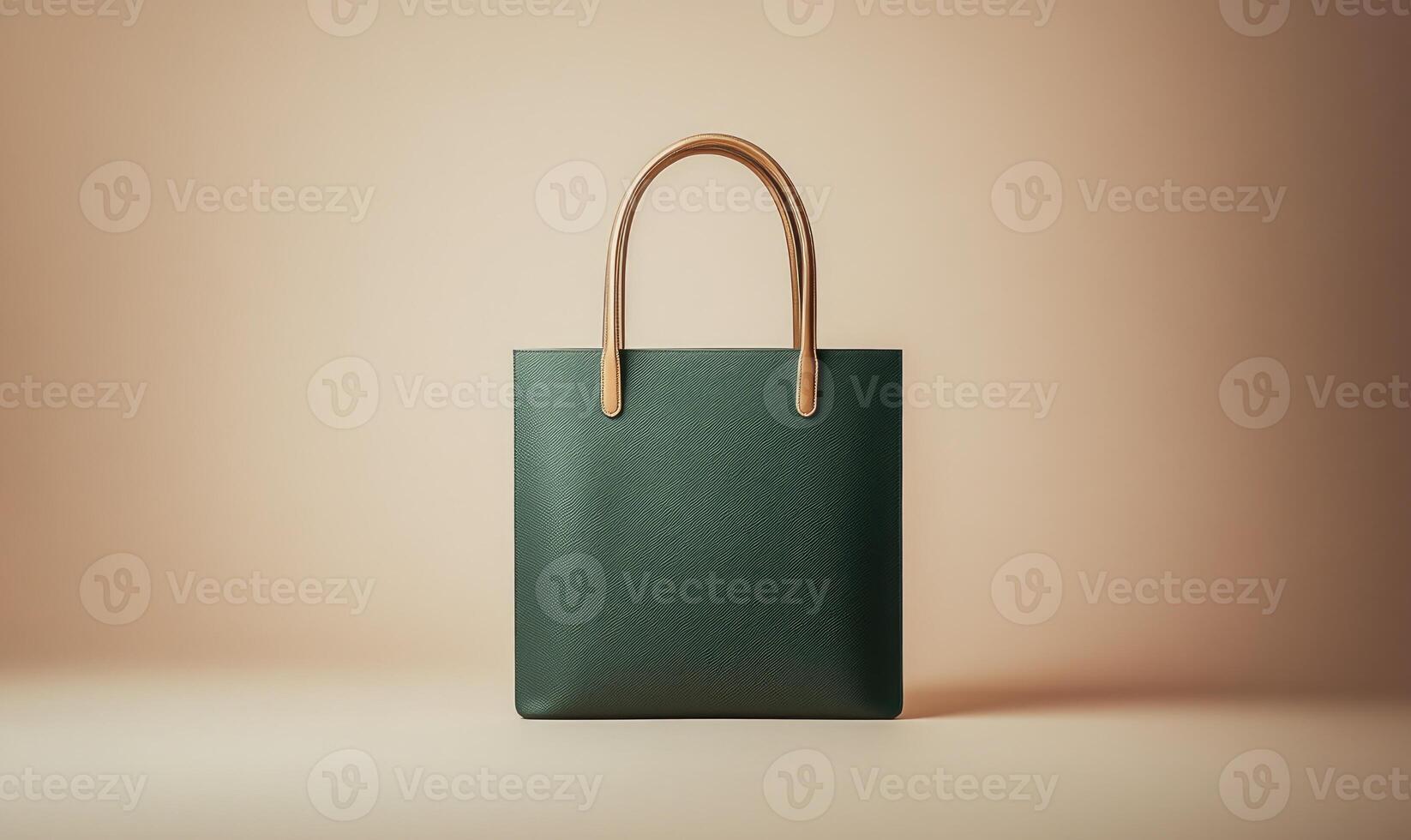 A green purse with a brown handle sits on a tan background photo