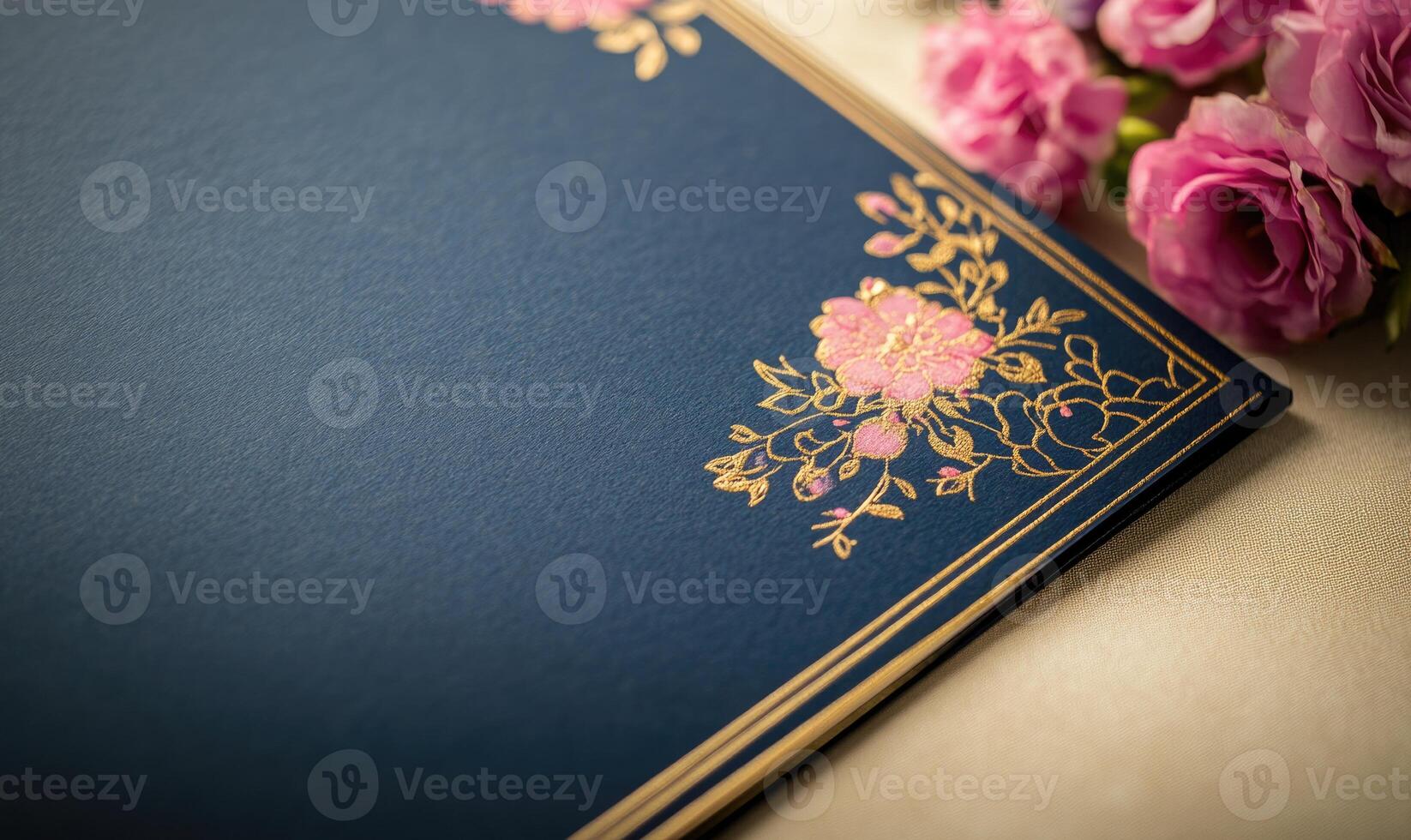 A blue card with a gold border and pink flowers on it photo