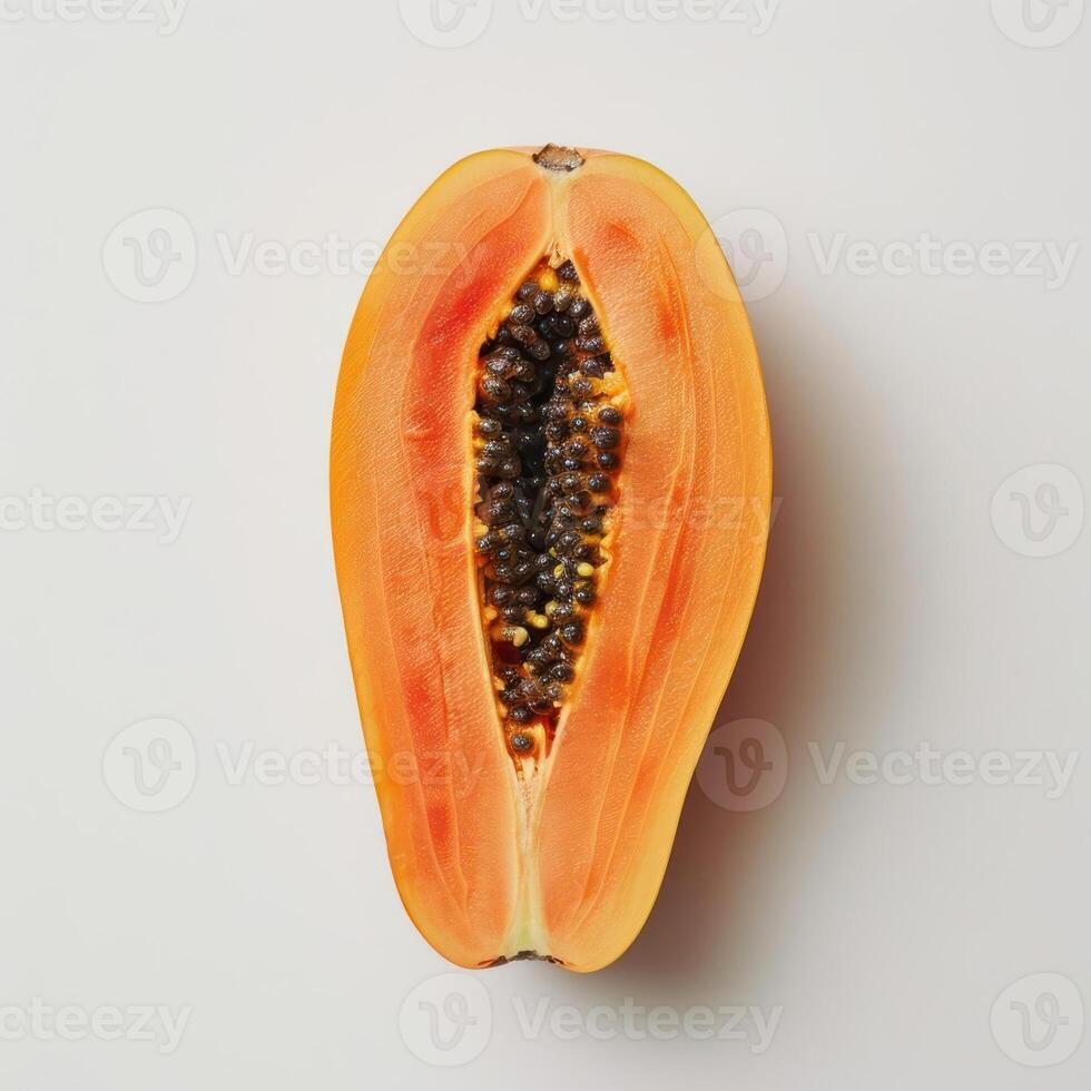 a cut open papaya on a white background photo