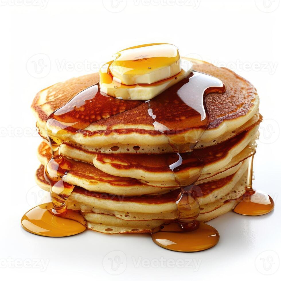 a stack of pancakes covered in syrup and butter photo