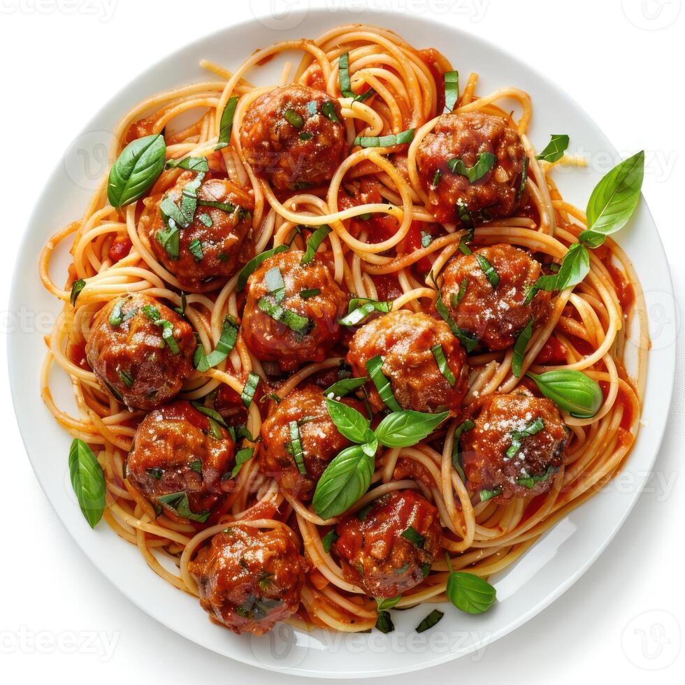 a plate of spaghetti with meatballs and basil photo