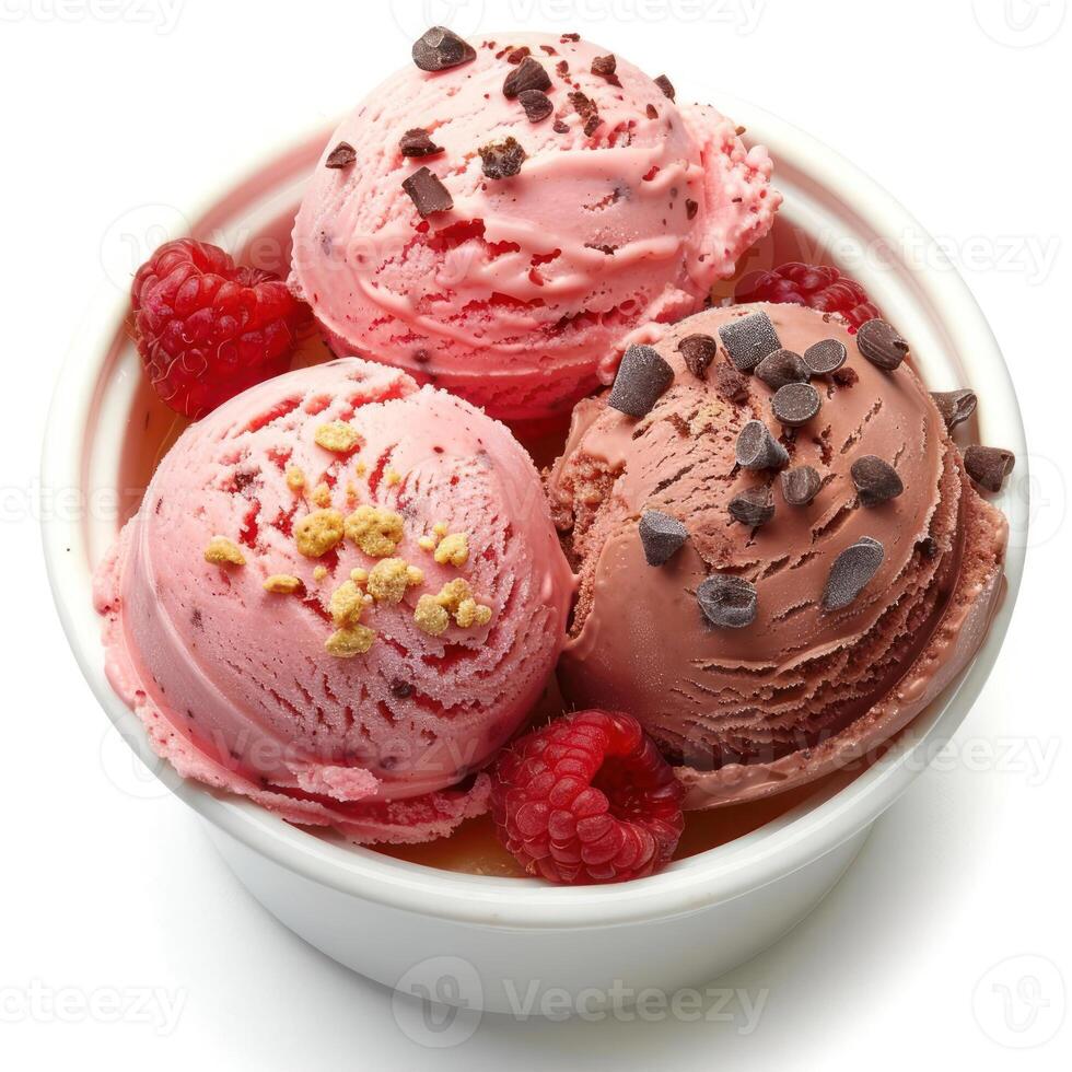 Six scoops of ice cream in a bowl, topped with raspberries and chocolate. photo