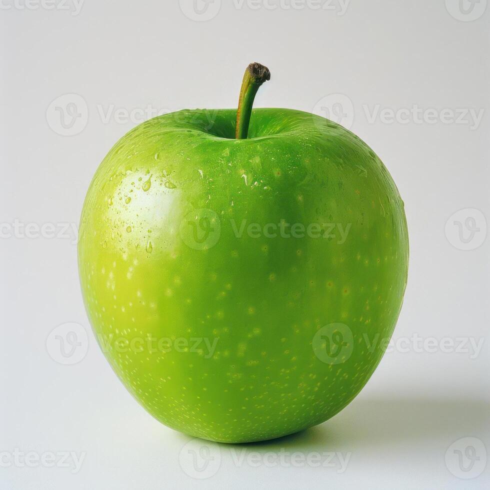 A single green apple with visible bruises and blemishes. photo