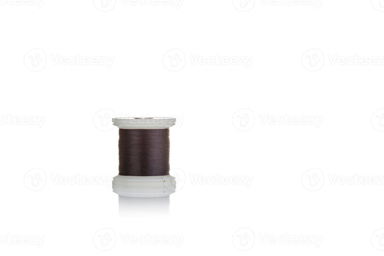skein of thread brown colors macro on a white background photo