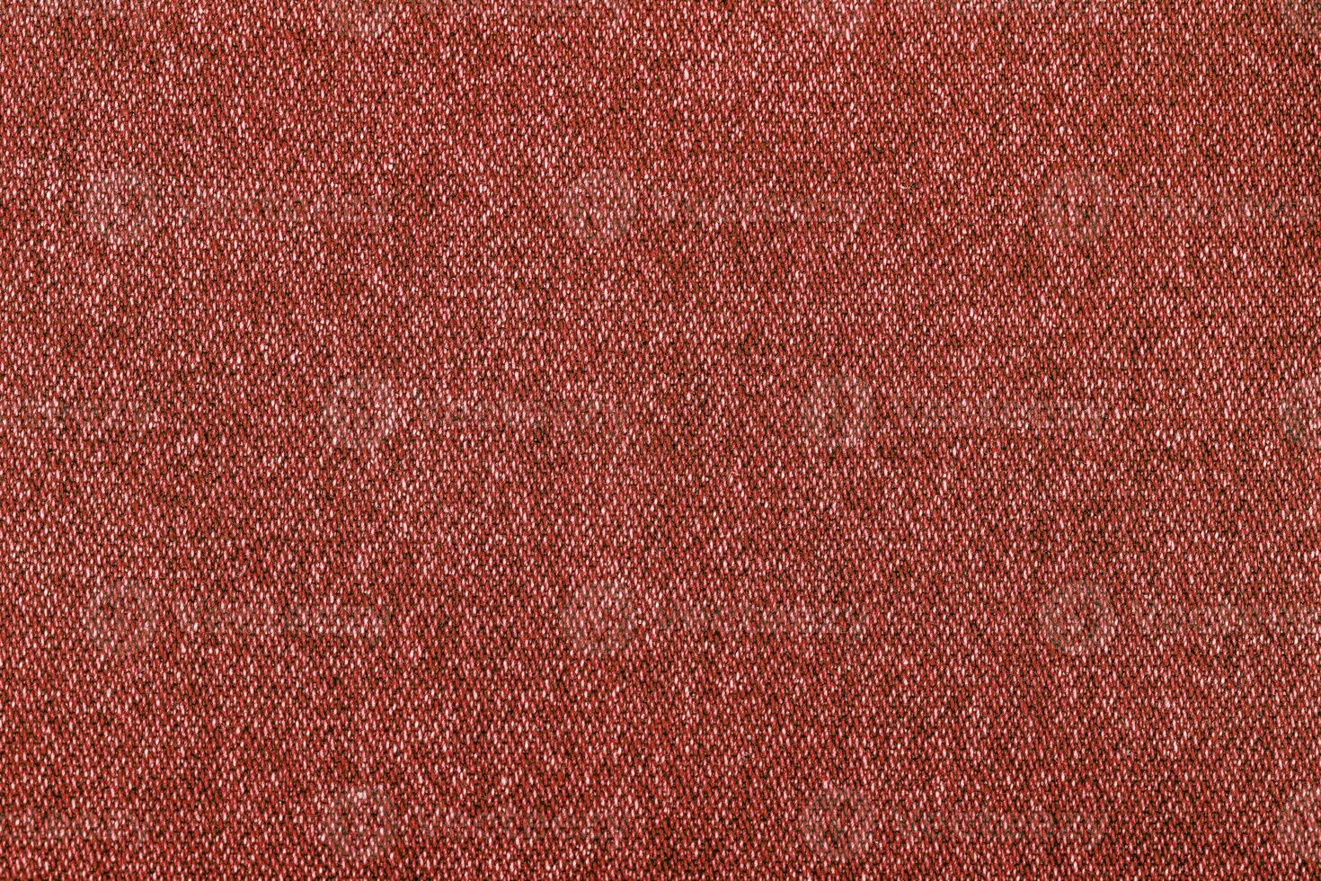 red color jeans texture, factory fabric on white background photo