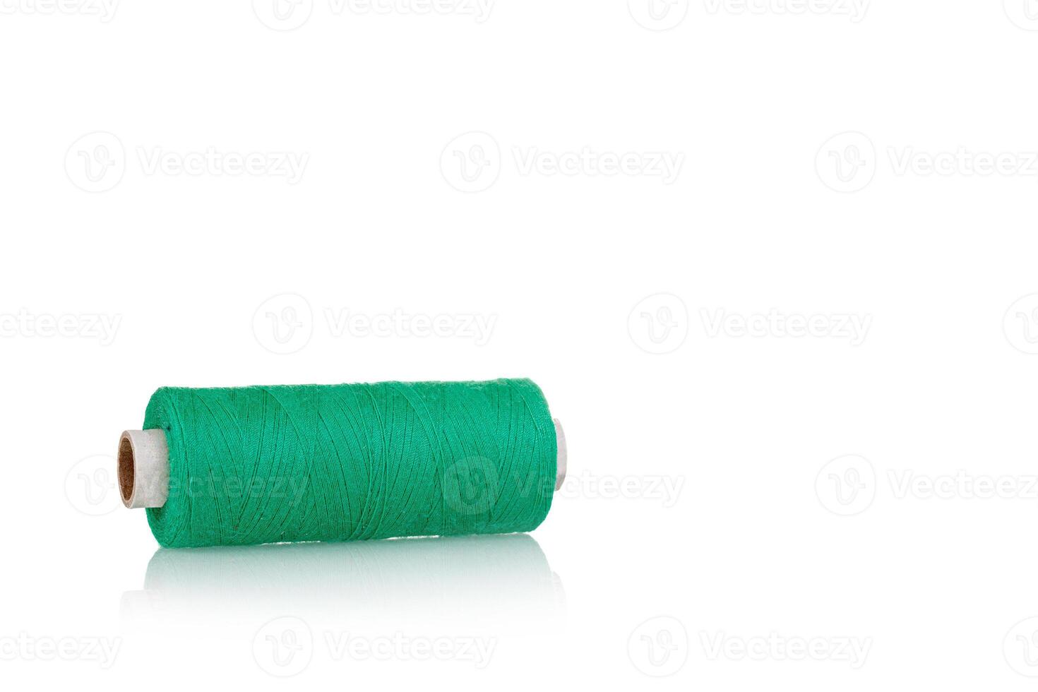 skein of thread green colors macro on a white background photo