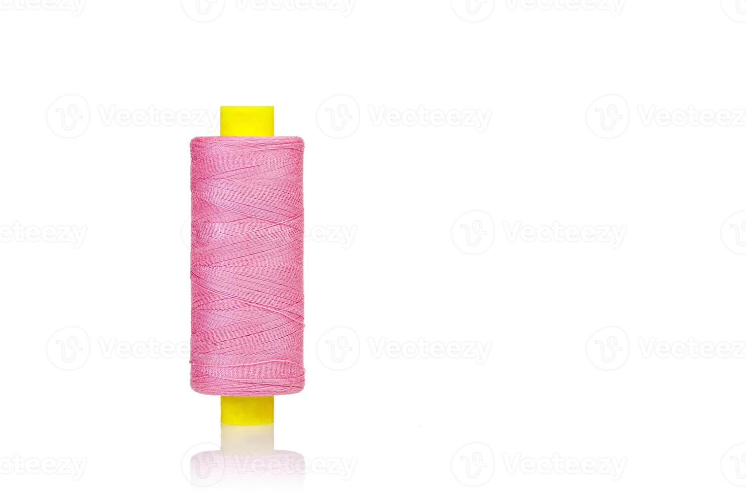 skein of thread pink colors macro on a white background photo