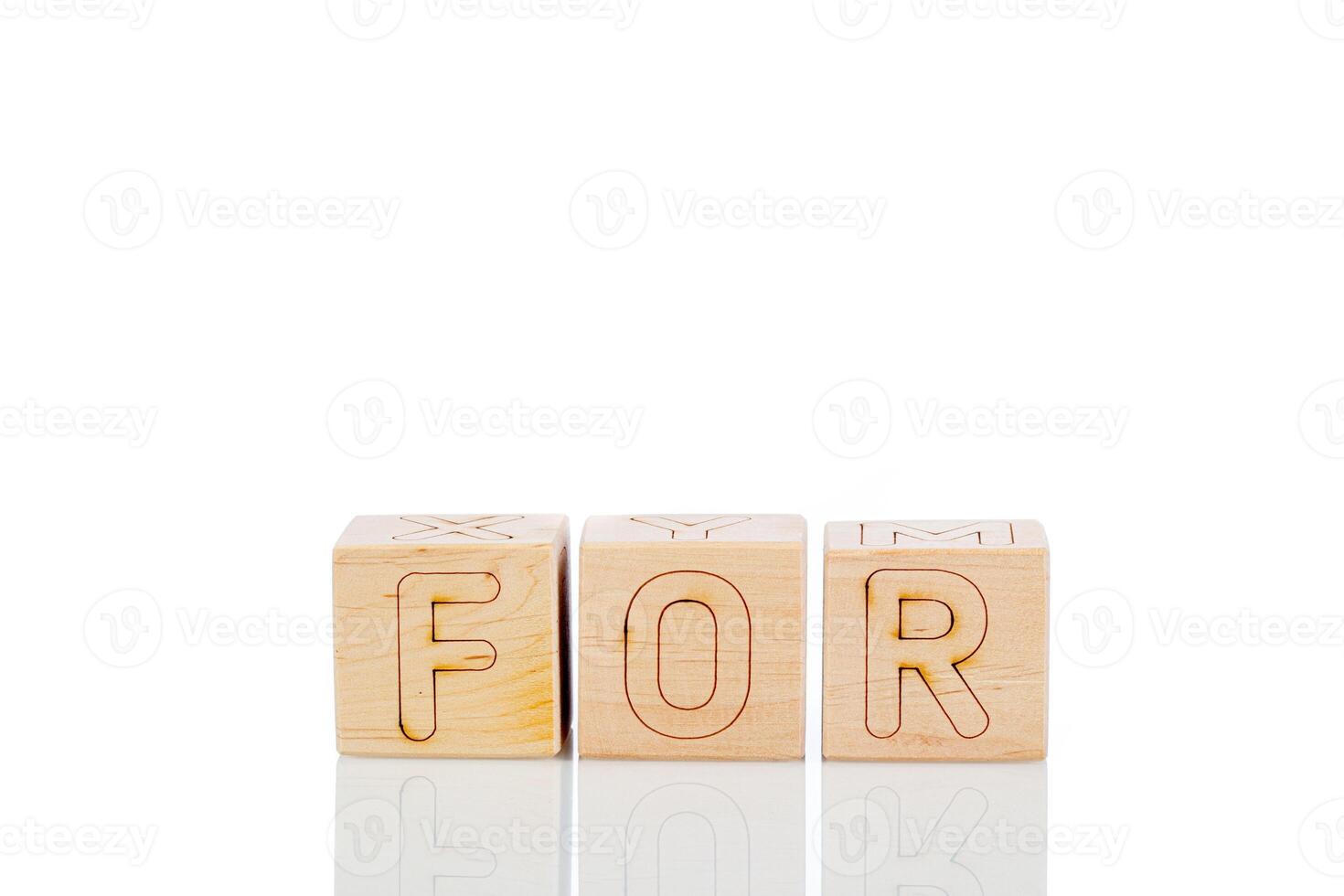 Wooden cubes with letters for on a white background photo