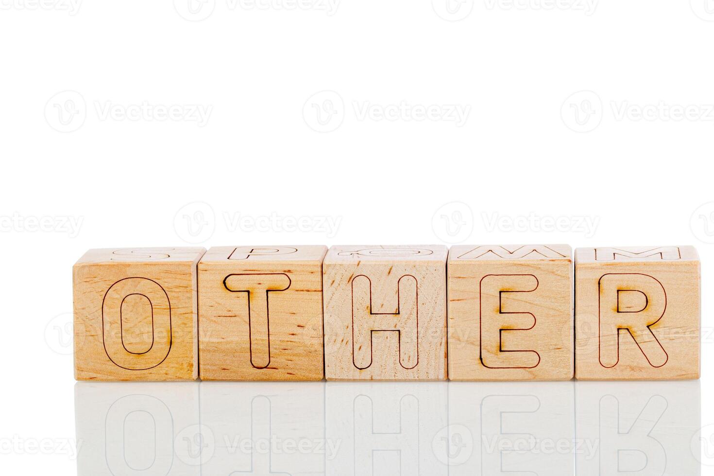 Wooden cubes with letters other on a white background photo