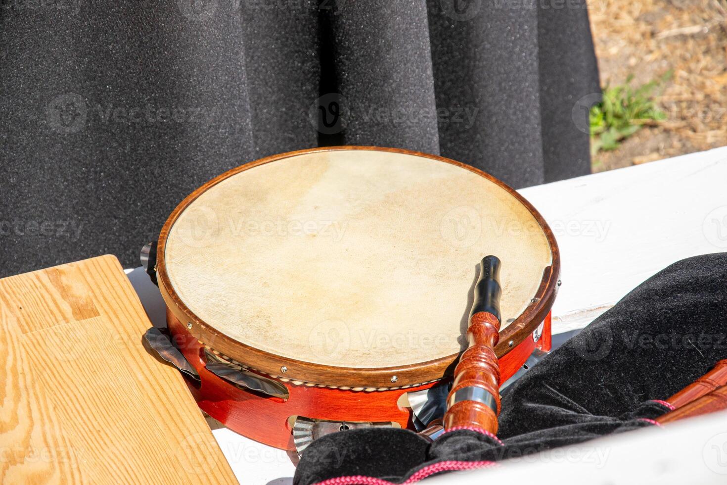 a tambourine and a bagpipe on a table at a folkloric event in Galicia, Spain. Folk music concept background photo