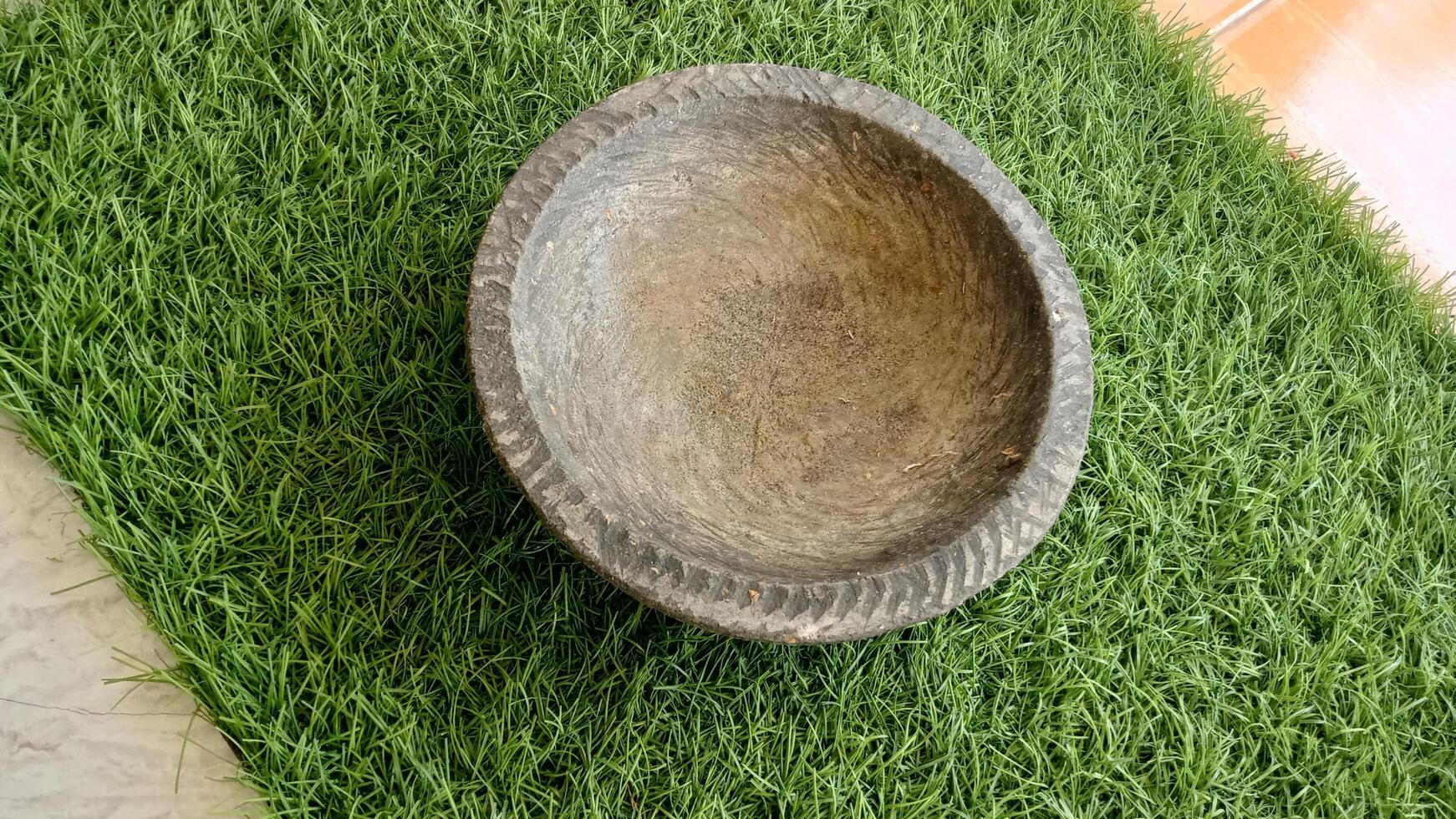 mortar and pestle equipment used to grind food spices photo