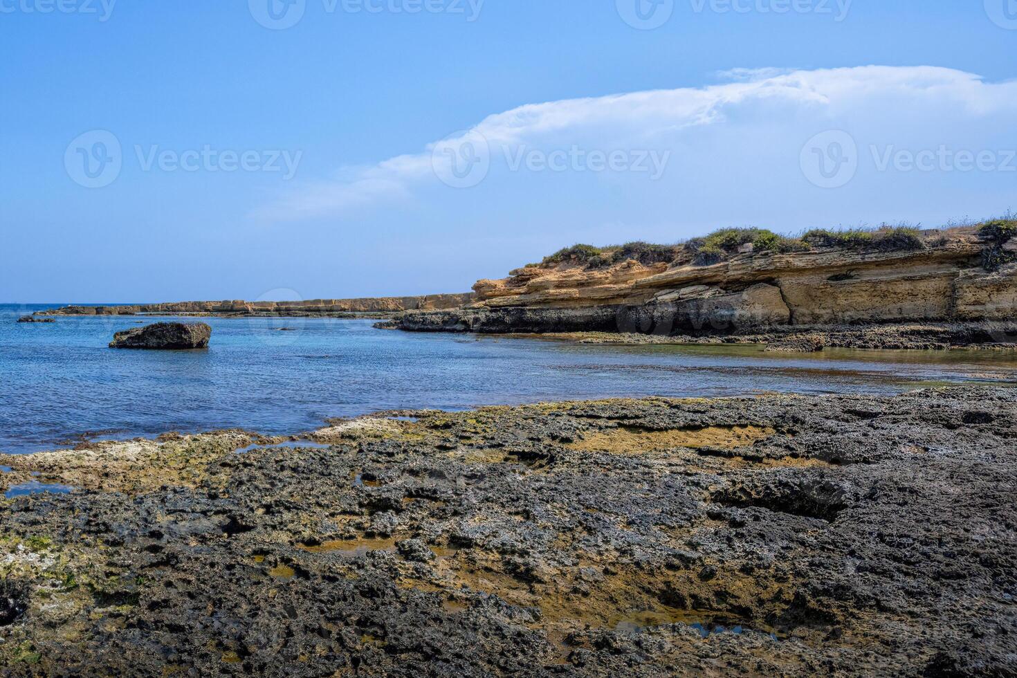 The blue water of the sea in the Plemmirio natural reserve in Sicily photo