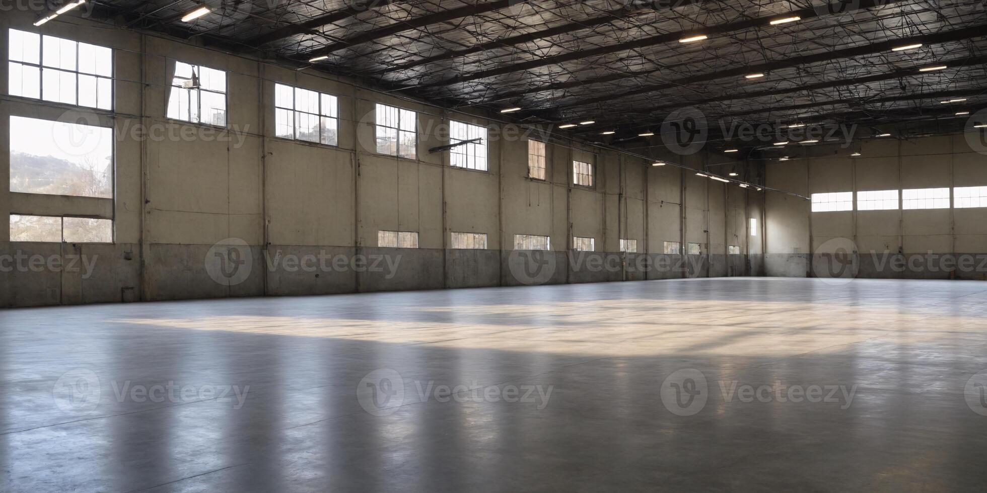Empty Industrial Warehouse with Concrete Floor and Large Windows photo