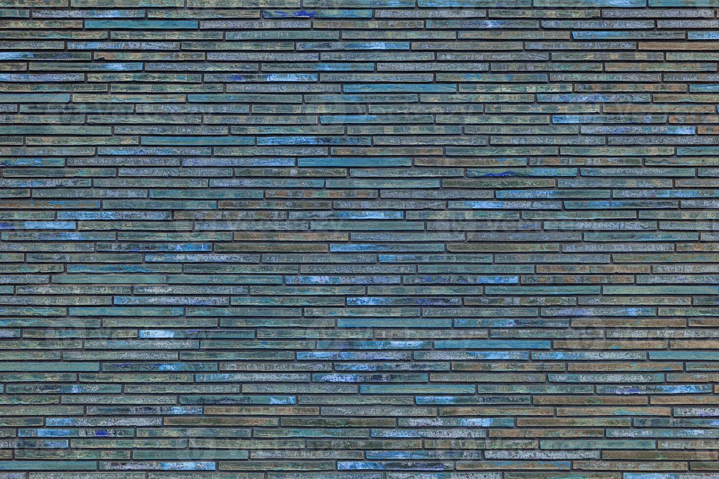 Texture of decorative blue brick wall. House facade. Wall in the loft. photo