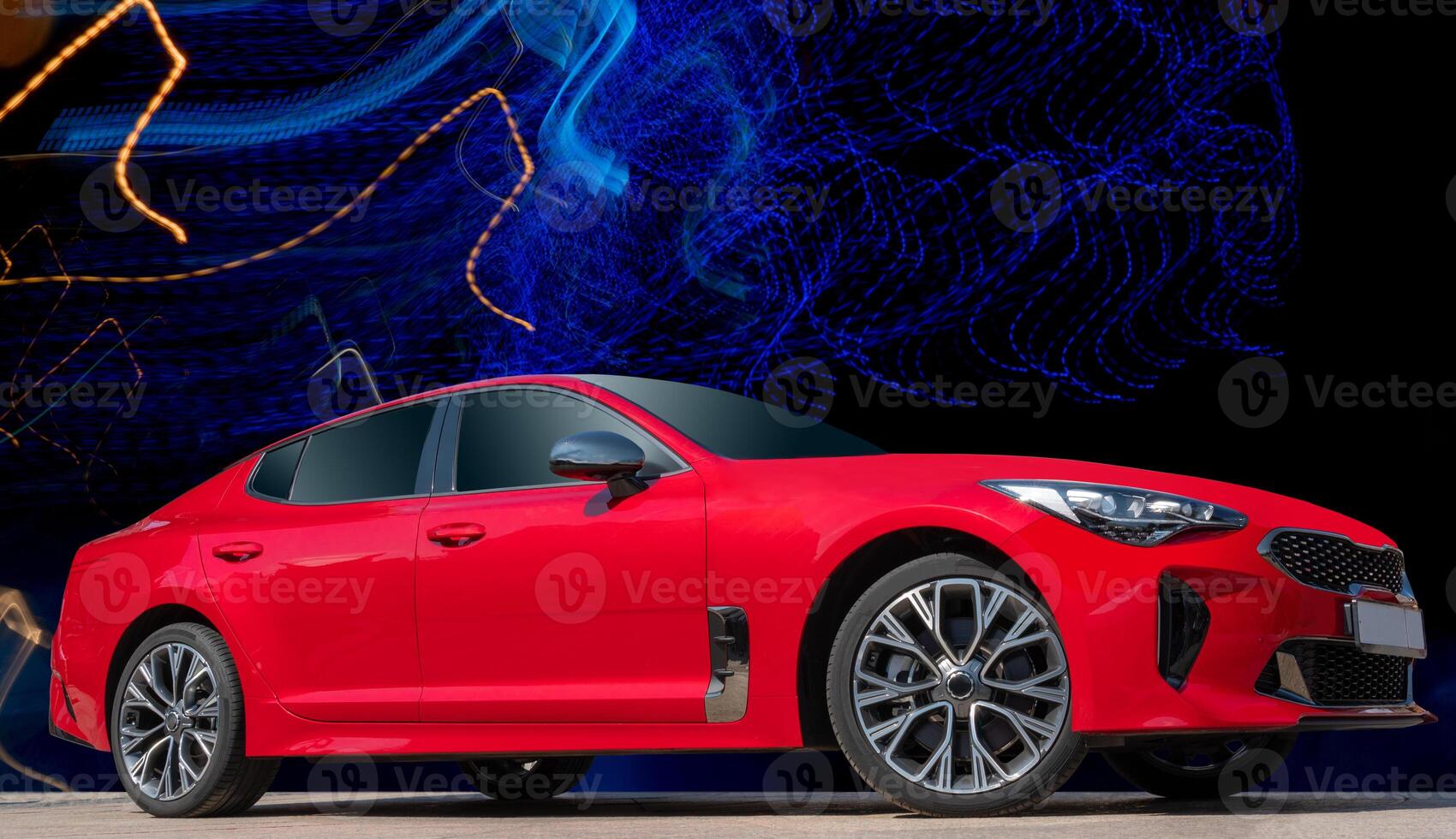 Red car on a black background. Stylish, modern, bright image of the car for design solutions. photo