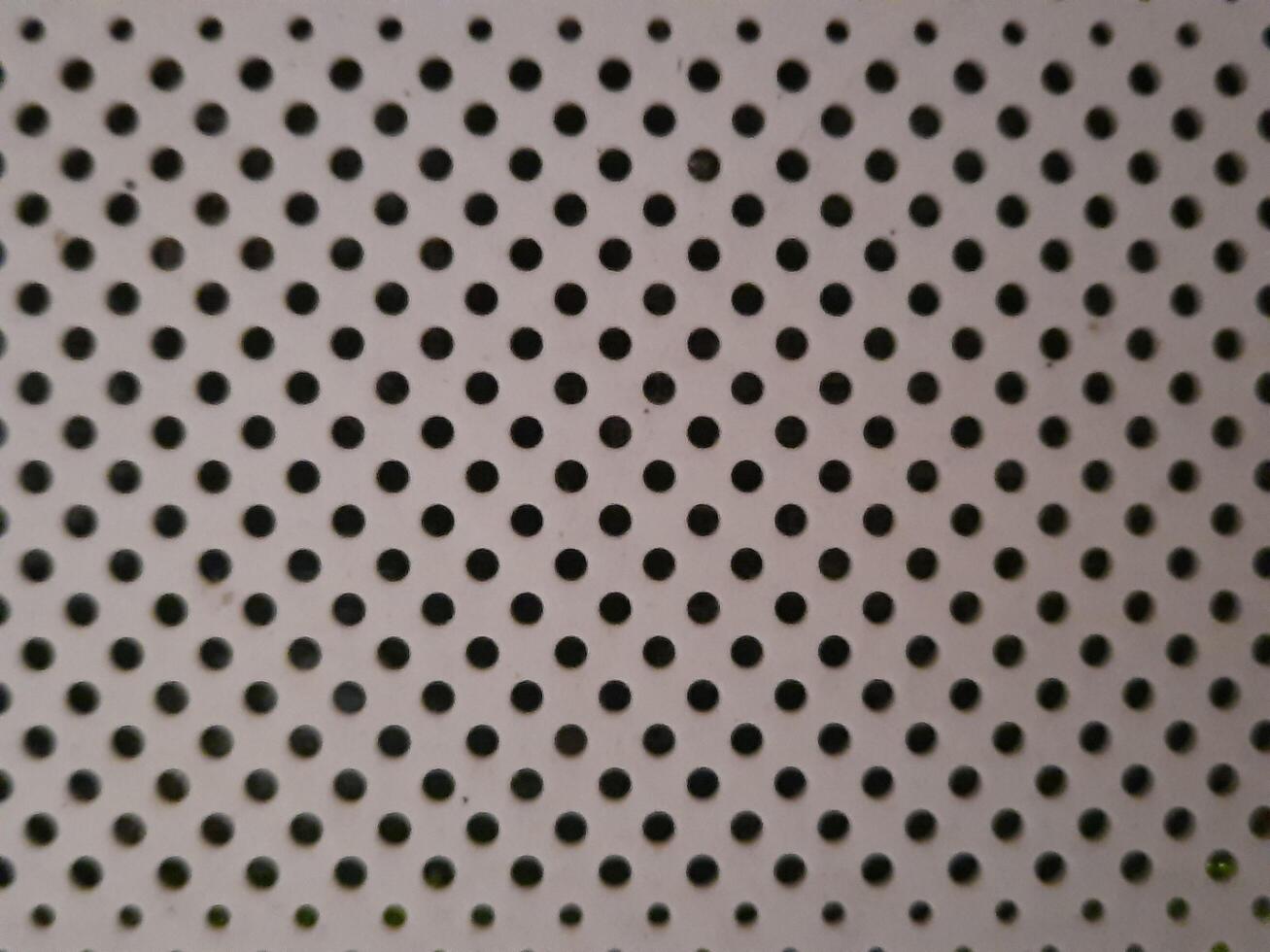 close up of acrylic sheet with holes photo