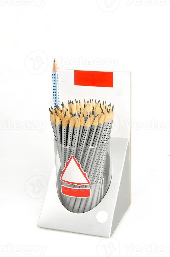 Neatly arranged set of pencils with dotted grips housed in a sleek metal canister, back to school with isolated white background Ideal for artists, students, or office use photo