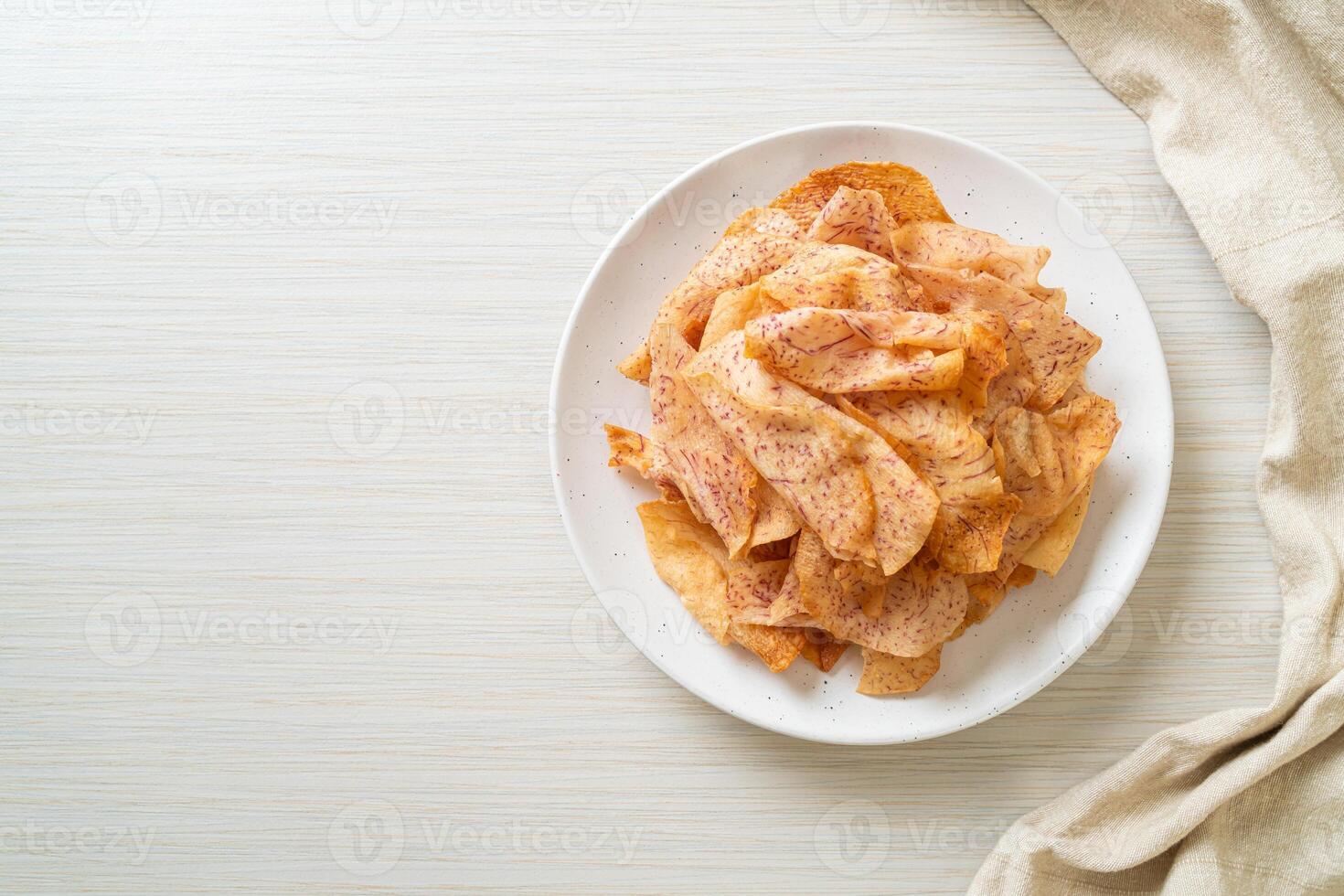 Taro Chips - fried or baked sliced taro photo