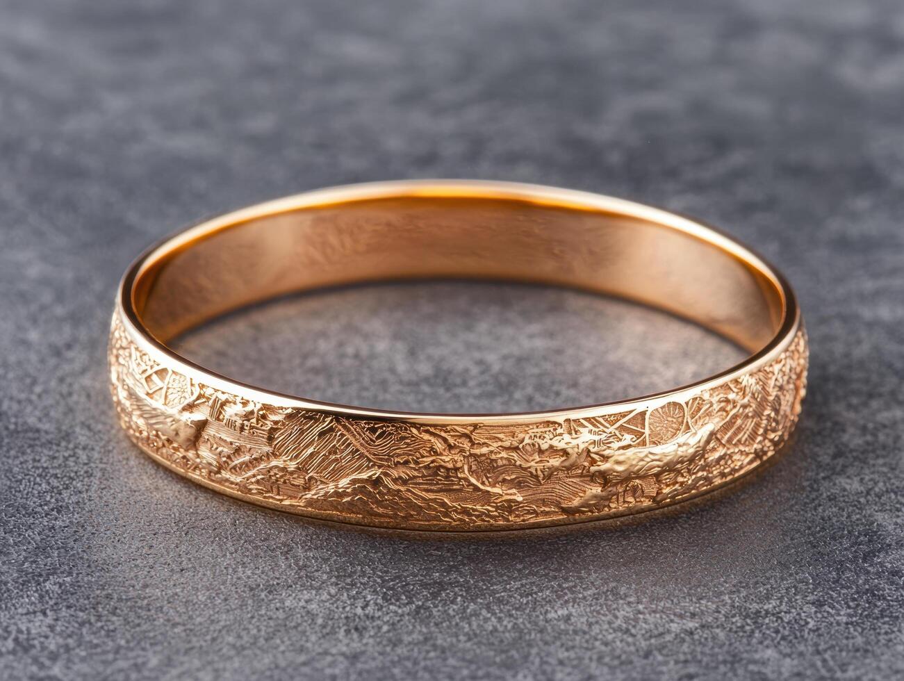 Ornate gold bangle bracelet with intricate engraved pattern photo