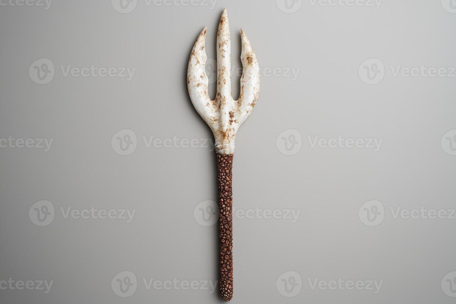 Decorative serving fork with textured handle photo