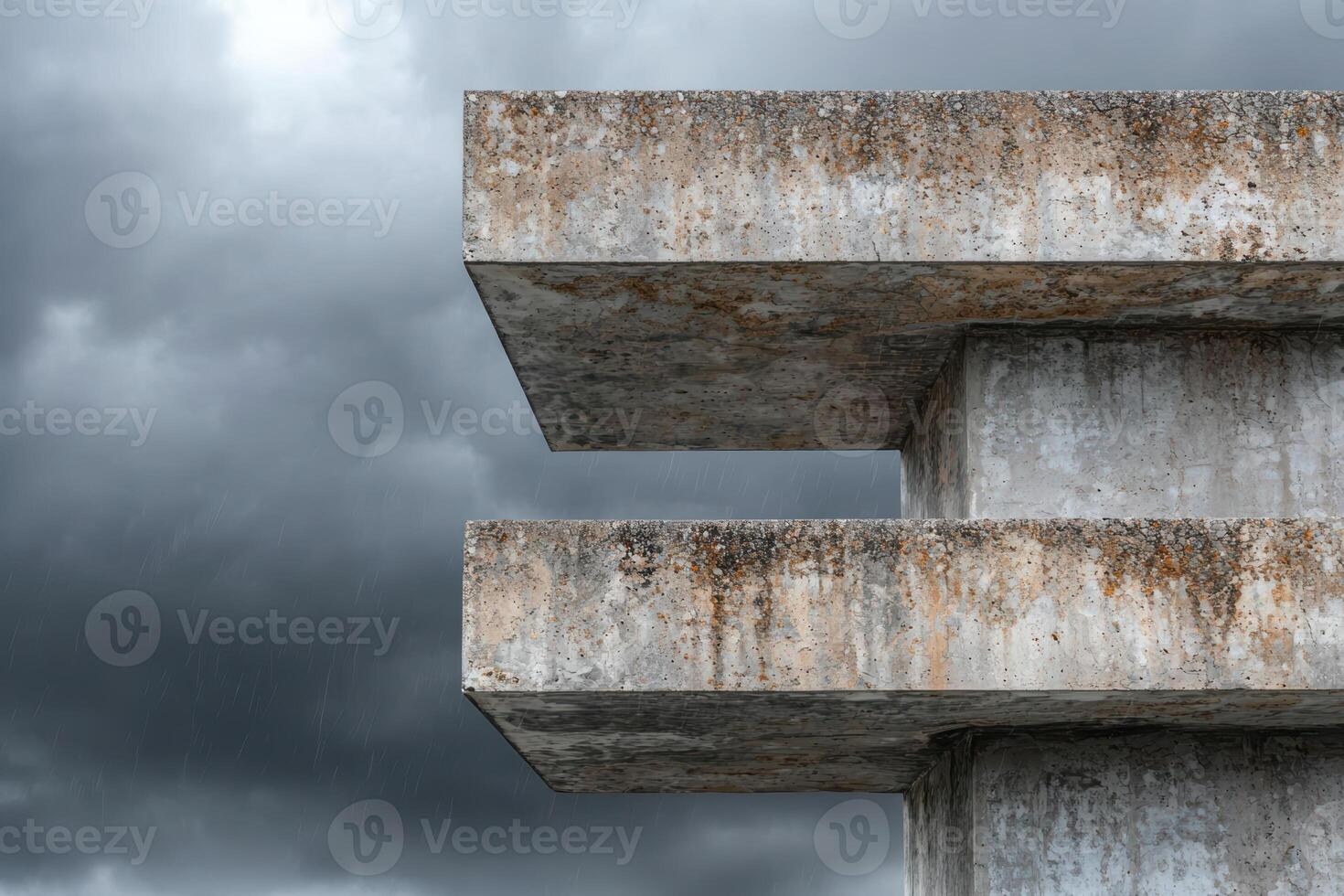 Concrete structure with weathered texture against cloudy sky photo