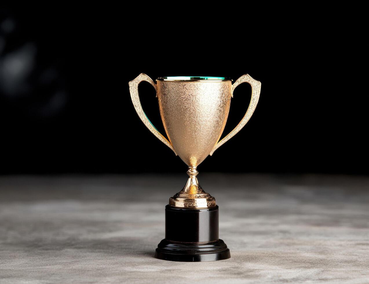 golden trophy on dark background photo