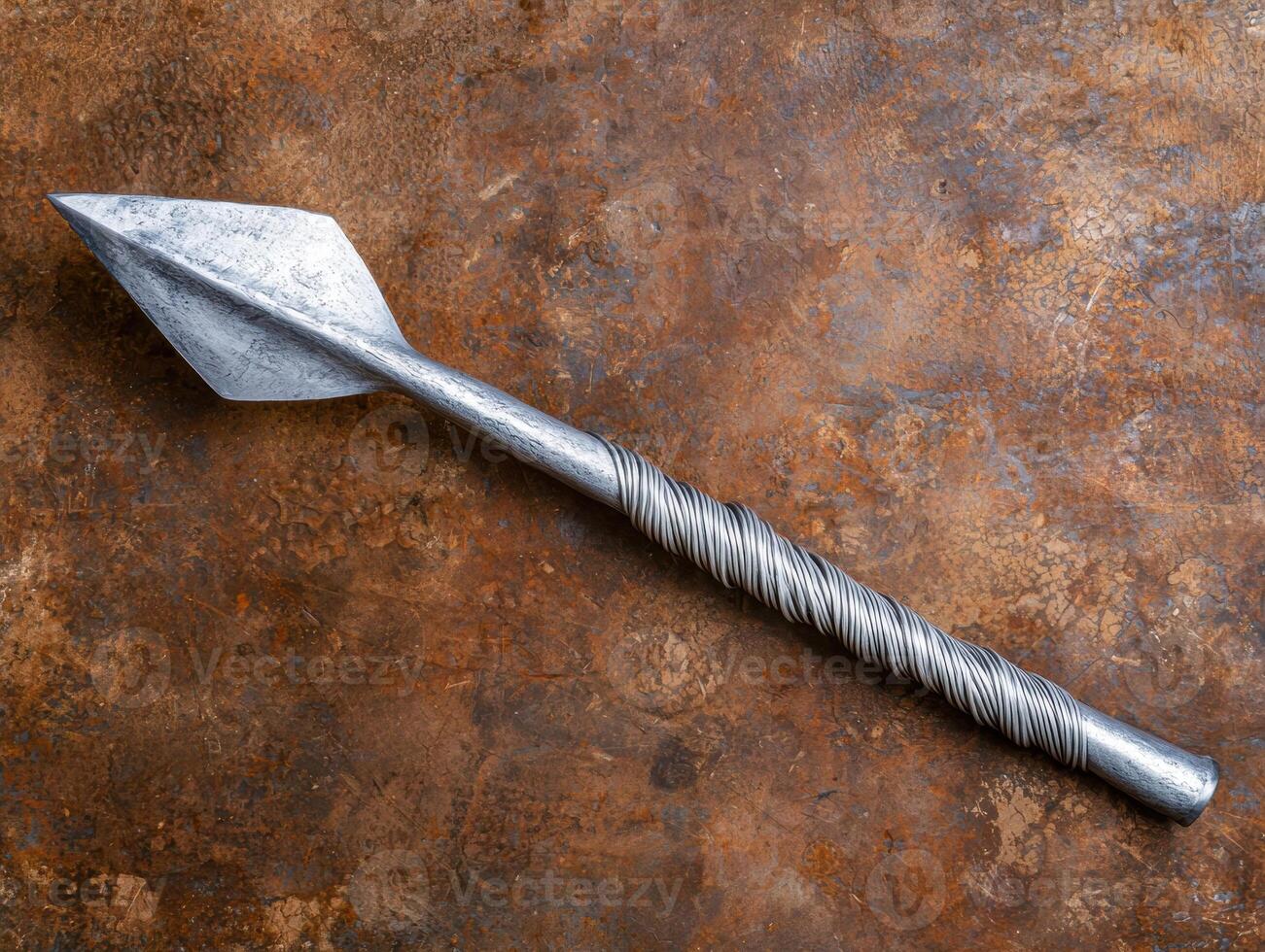 Rusted metal surface with a twisted steel drill bit photo