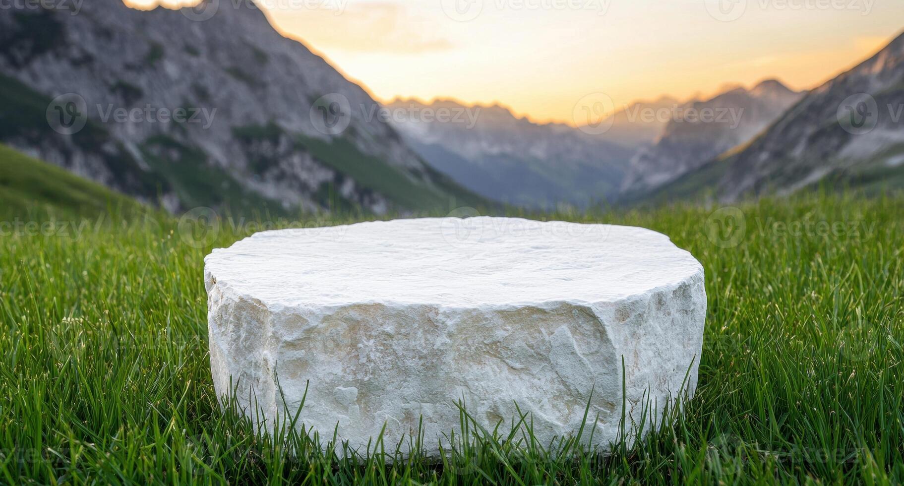 Scenic mountain landscape with stone pedestal in foreground photo