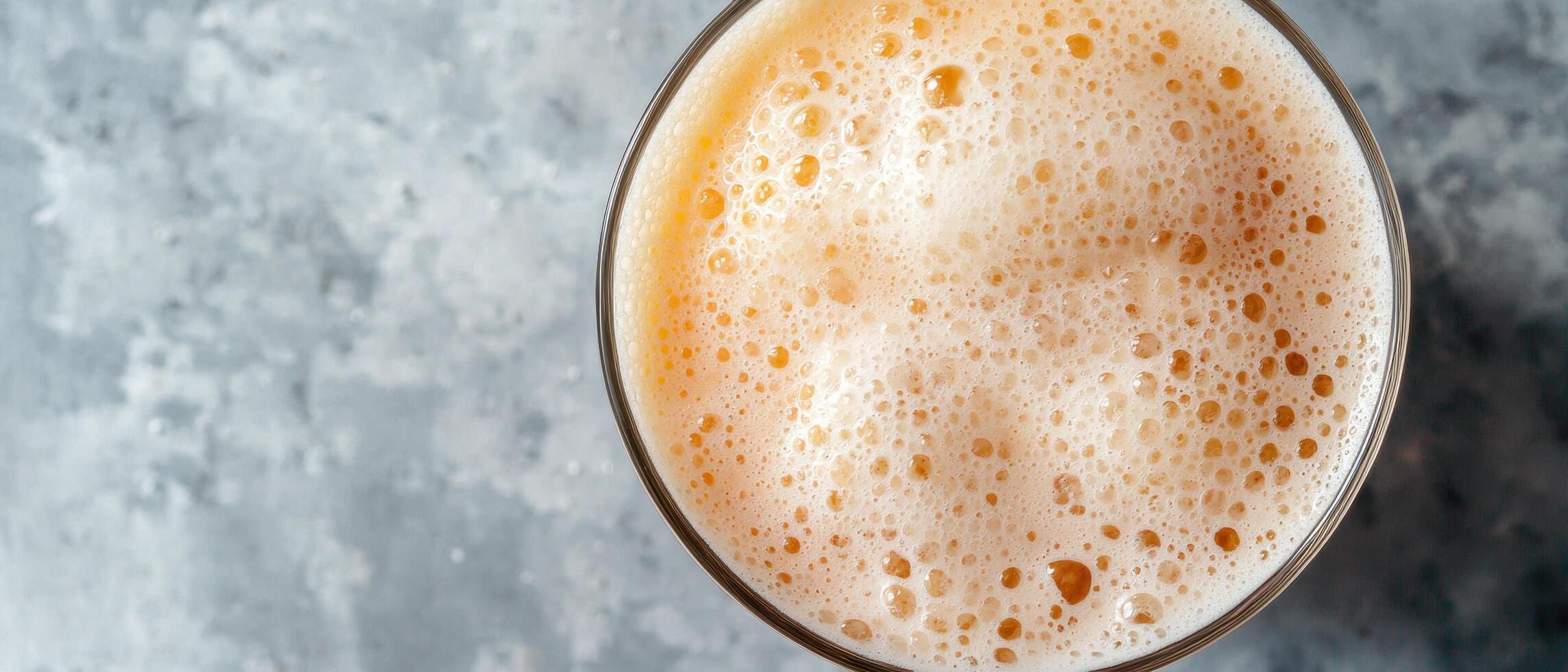 close up of a glass of frothy beer photo