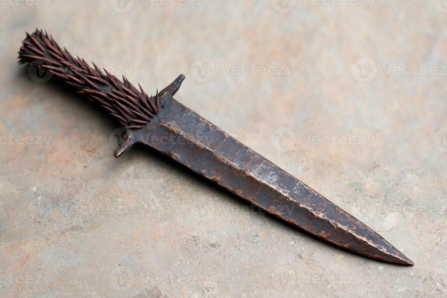 Rugged metal knife with spiked handle photo